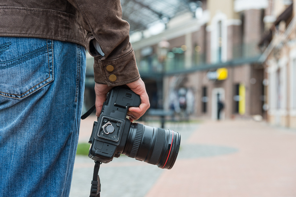 Photographer with camera in the city